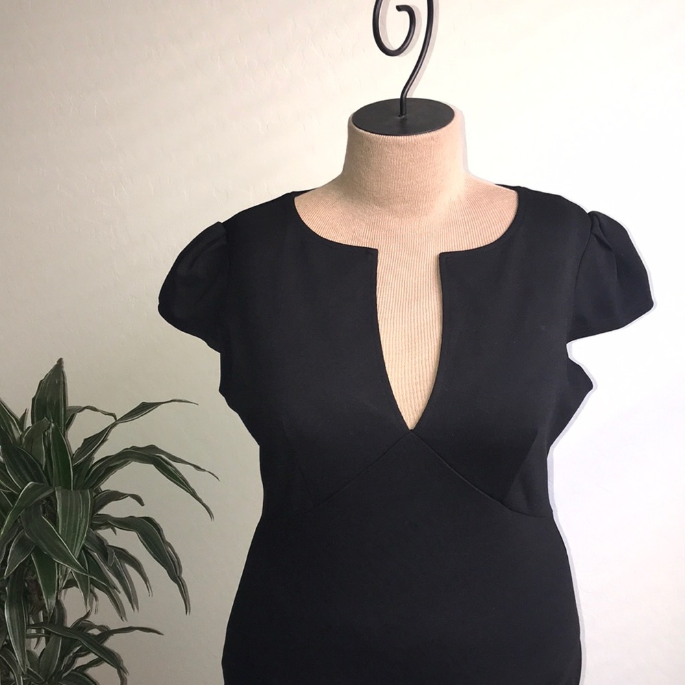 Black pencil dress with a deep neckline